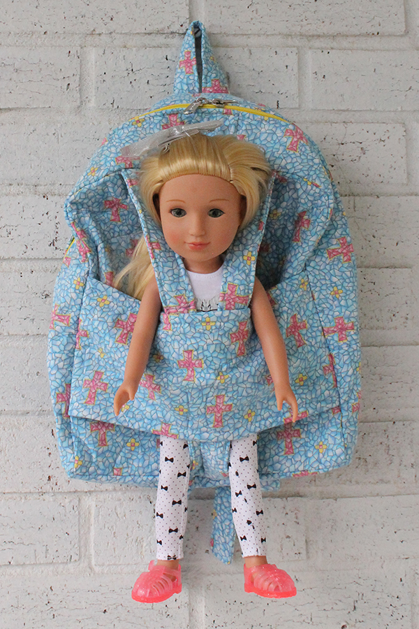 Cross Doll Carrier Backpack with Glitter Girl Doll in doll pocket